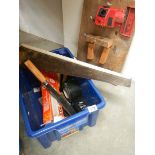 A box of tools and a drill sharpener.