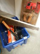 A box of tools and a drill sharpener.