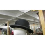 A Perfecta half size bowler hat.