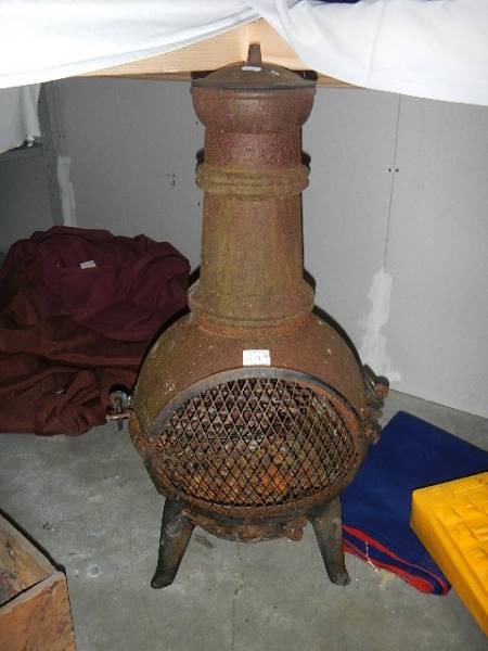 A garden chiminea. ****Condition report**** Made of cast iron.