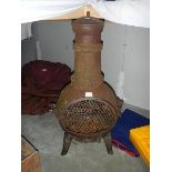 A garden chiminea. ****Condition report**** Made of cast iron.