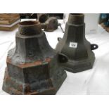 Two cast metal gutter drainage hoppers.