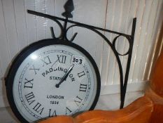 A circular wall mounting 'Paddington' wall clock.