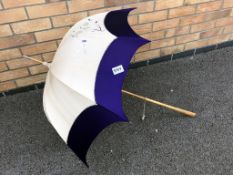 An early 20th century Japanese cotton and purple silk ladies parasol embroidered with flowers and