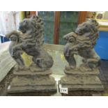 Two cast iron door stops modelled as rampant lions, circa 1900.