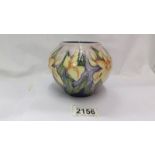 A Moorcroft small bulbous floral design vase (second).