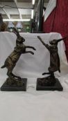 A pair of Bronzed spelter boxing hares on marble bases.