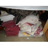 A quantity of bedspreads, curtains etc.