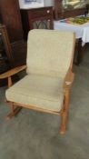 A Scandard wood framed rocking chair.