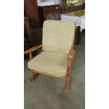 A Scandard wood framed rocking chair.