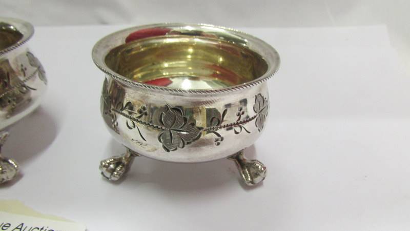 A pair of Victorian silver plate salts with ball and claw feet and decorative design. - Image 2 of 3