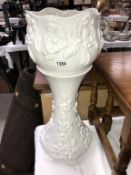 A white pottery jardiniere on stand (chips to top of stand)