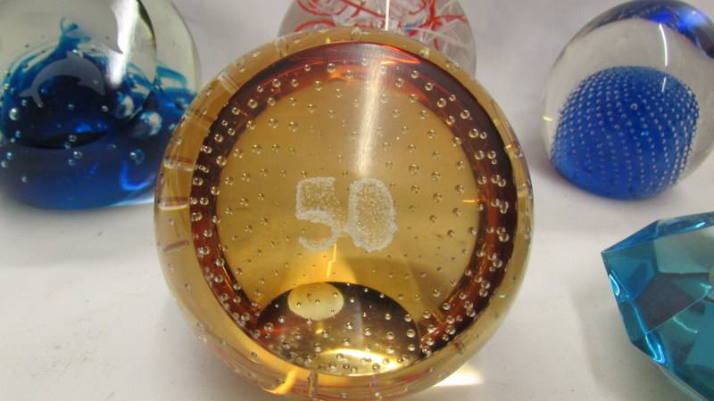 Five glass paperweights and a perspex Royal Mint paperweight inset with £1 coin. - Image 6 of 7