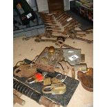 A mixed lot including stair carpet clips, padlocks etc.
