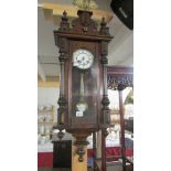 A Victorian mahogany wall clock.