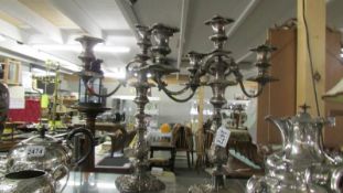 A pair of silver plate candelabra.