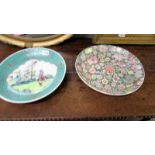 Two 32cm diameter Chinese plates, one floral and one with painted scene.