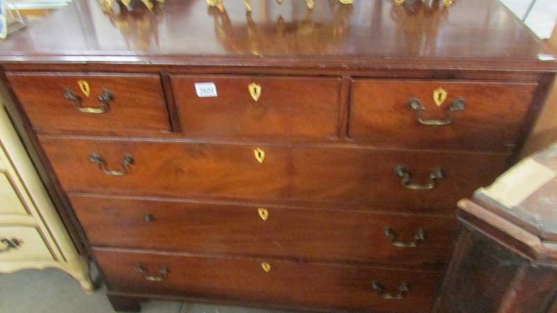 A 3 over 3 mahogany chest of drawers.