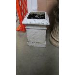 A square chimney pot.