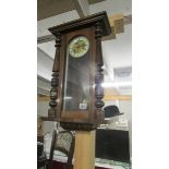 A mahogany wall clock.