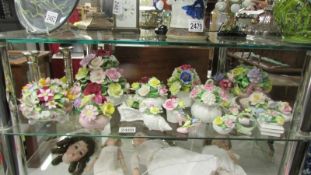 A collection of porcelain posies including Minton, Royal Doulton etc.