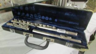 A cased silver plate flute.