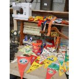 A large quantity of pennants, a sewing machine and sewing items etc.