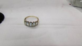 A 9ct gold five stone aquamarine? ring, size O half.
