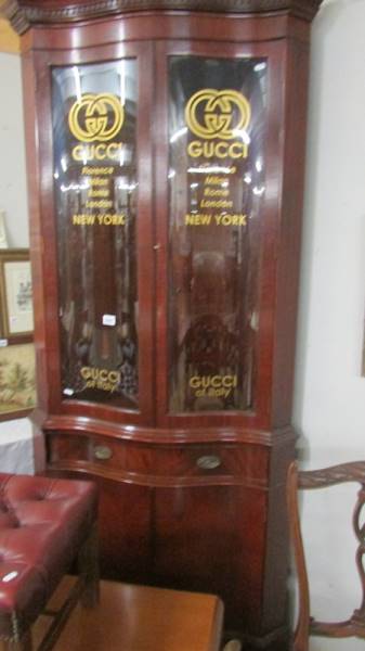 A Gucci corner cupboard.