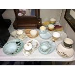 A quantity of vintage sandwich plates with cups