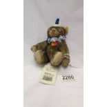 A small Steiff clown bear.