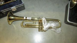 An OIK "Amati Kraslice" trumpet with mouthpiece.