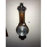 An Edwardian carved oak barometer (length 51cm)