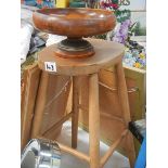 An old pine stool and a wooden fruit bowl.