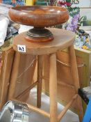 An old pine stool and a wooden fruit bowl.