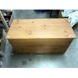 A pine effect blanket/storage box