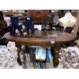 A heavy oak coffee table with slate centre