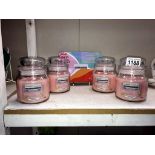 4 new Yankee candles (medium size)'Pink Island sunset & box of tea lights