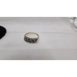 A 9ct gold ring set 8 white and 8 blue stones, size J.