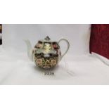 An early Macintyre Imari pattern teapot in good condition.