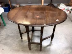 A 1930/50's oak gate leg table, 73 x 34 cm closed, 104 x 73 cm open, 73 cm high.