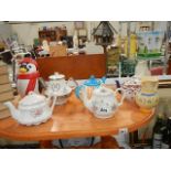 A collection of china tea pots in good condition.