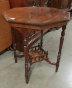 An octagonal mahogany occasional table.