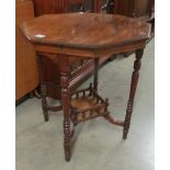 An octagonal mahogany occasional table.