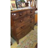 A two over three mahogany chest of drawers.