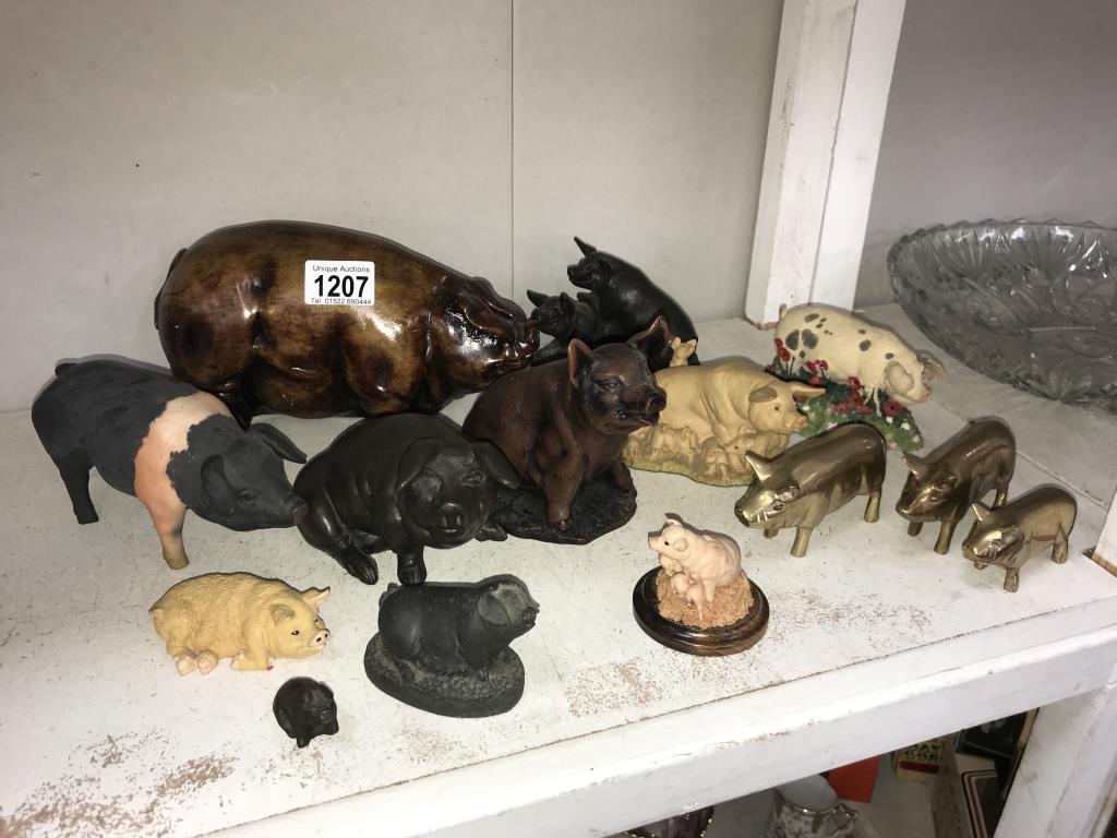 A collection of pig figures including 3 brass,