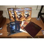 A collection of Advanced Dungeons & Dragons manuals including 5 players handbooks