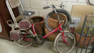 A vintage Capital electric bicycle in need of restoration.