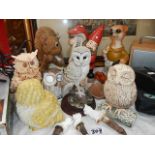 A quantity of animal garden ornaments including owls.