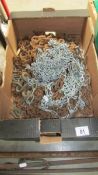 A box of old metal chains.